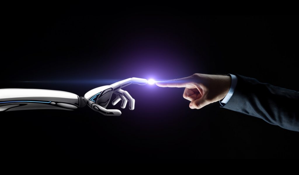 Future of work A robotic finger touches a human finger, showing the future of work